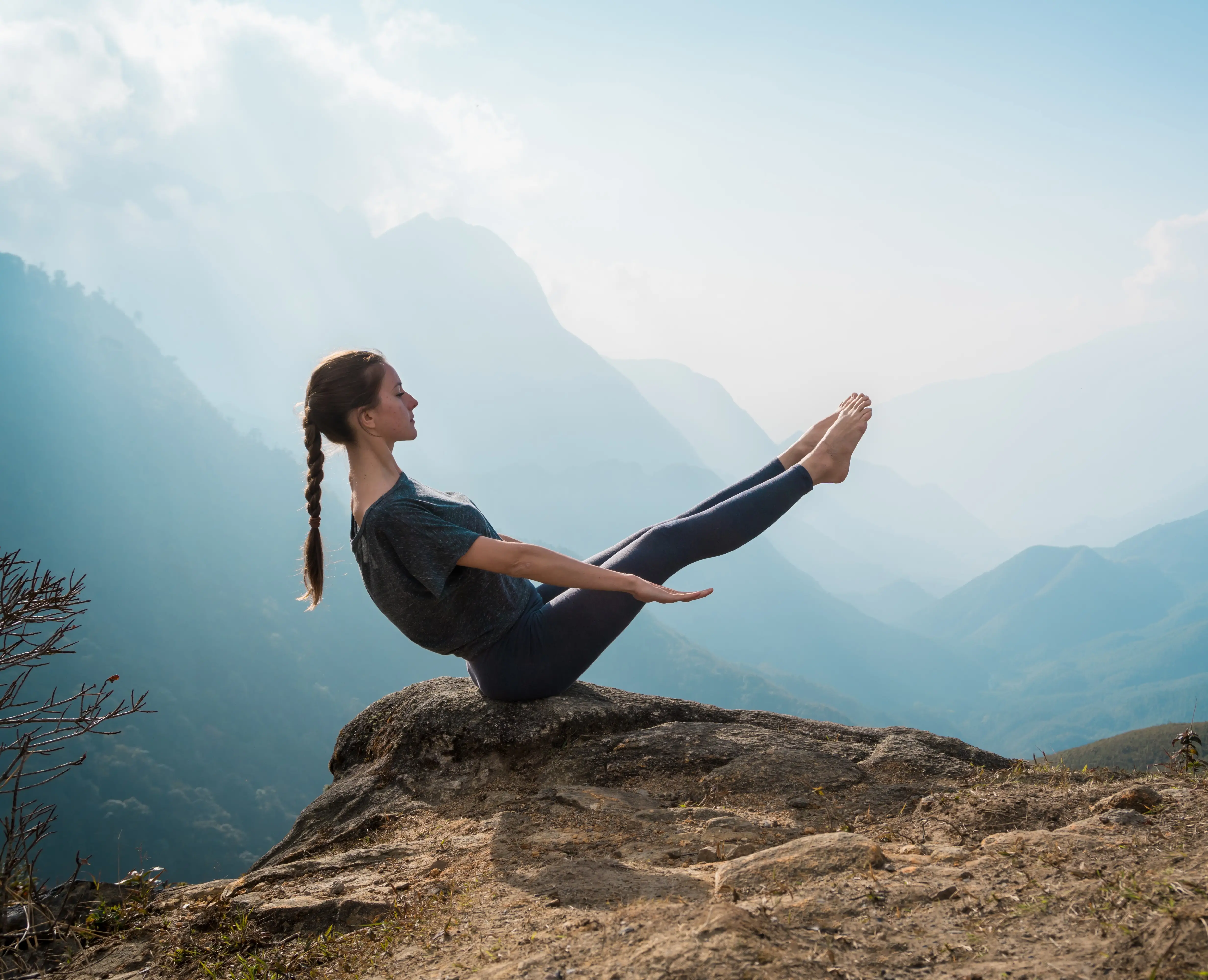 Woman practicing Pilates outdoors